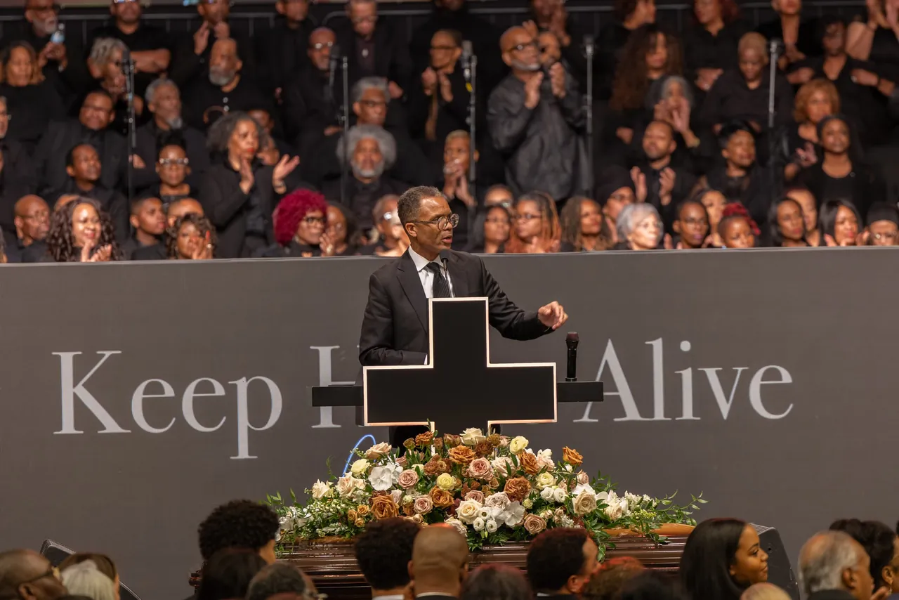 Mayor Brandon Johnson speaks in front of the words Keep Hope Alive