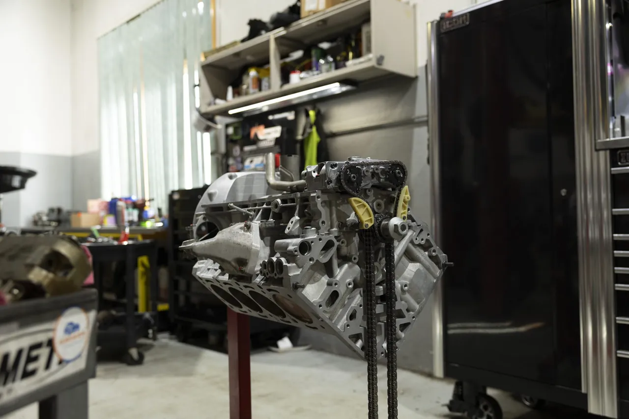 An engine on a stand in a quiet corner of the shop
