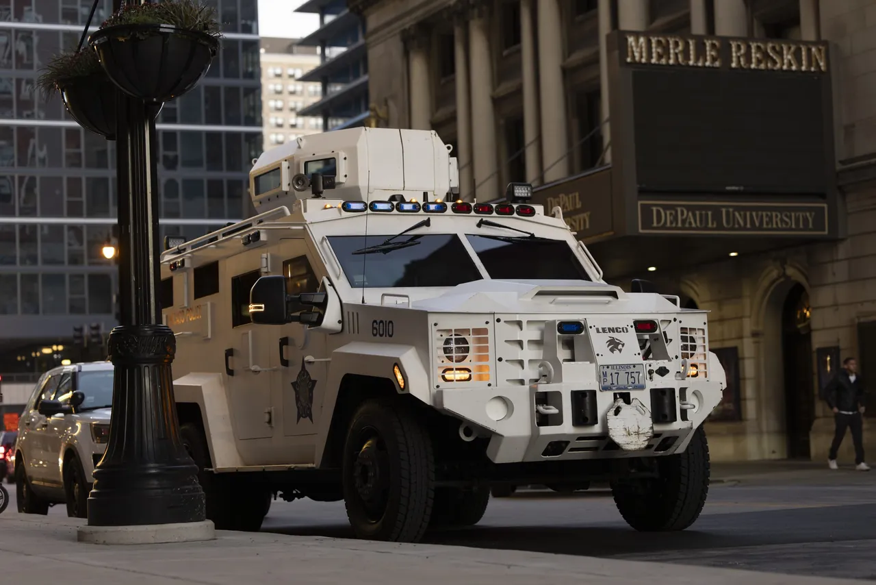 An armored police vehicle parked on a downtown street before dawn