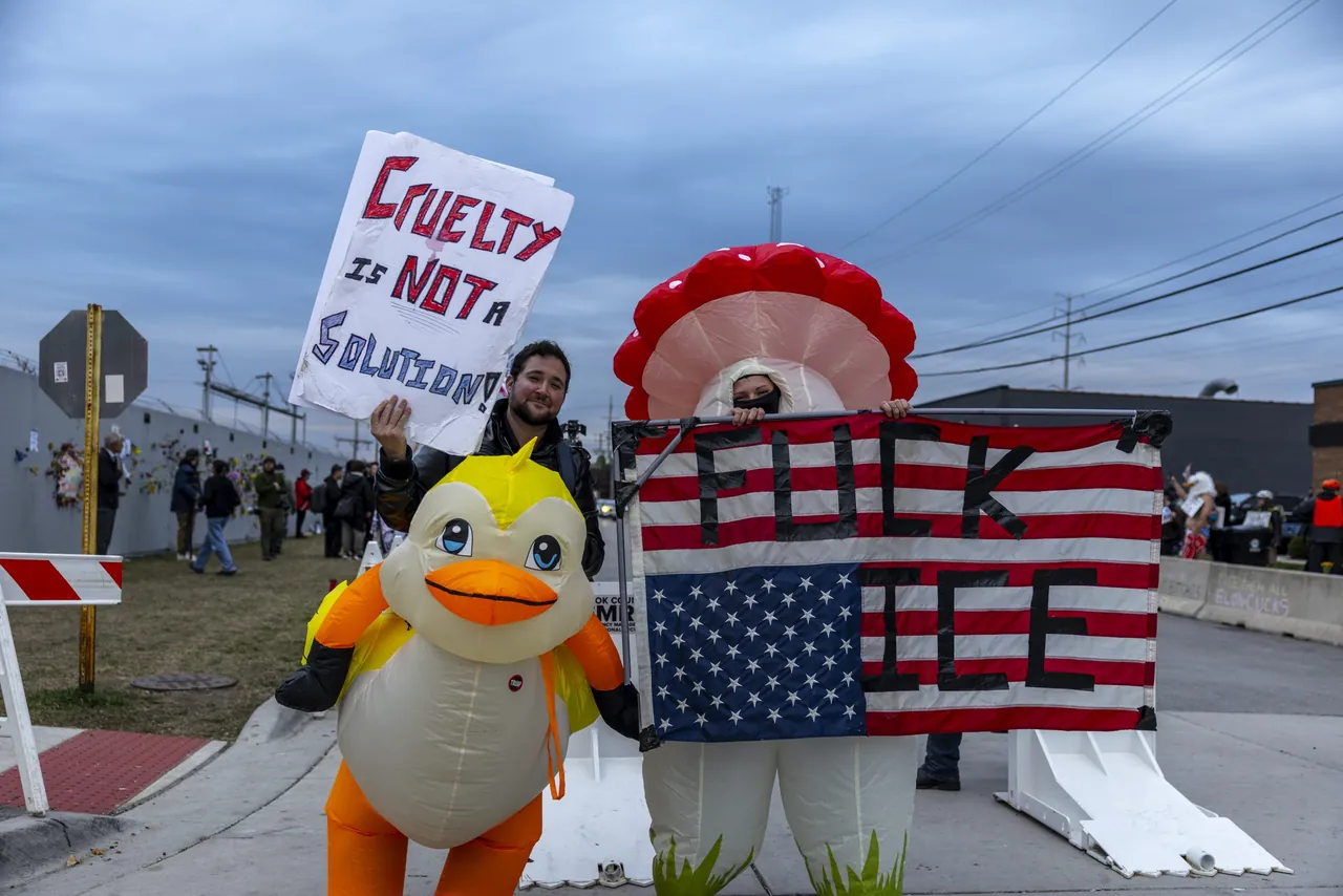 A sign reading Cruelty is not a solution above an inflatable duck and a flag