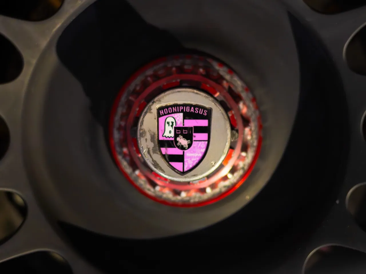 A Porsche crest on a wheel center cap