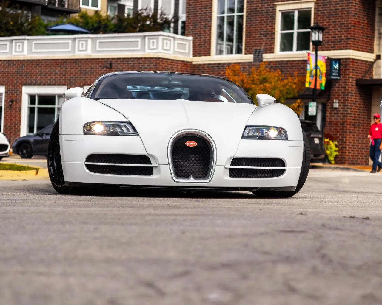 A white Bugatti Veyron from low on the pavement
