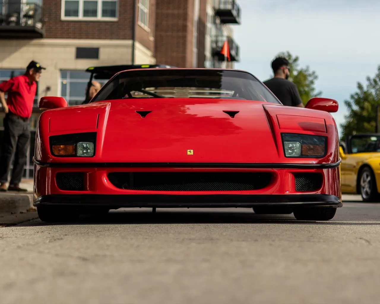 A red Ferrari F40 at a car meet